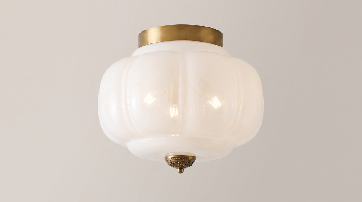 Eloise ceiling light seen from below showing three lamps behind one fluted glass shade