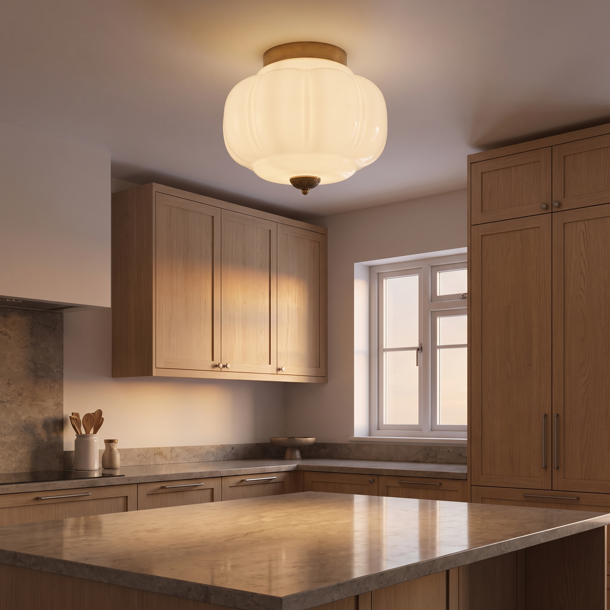Odile milk glass pumpkin ceiling light lit in a kitchen
