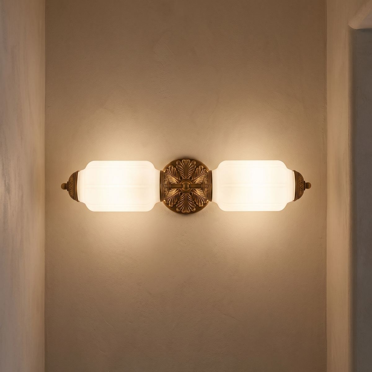 Wren vanity bar lit on a plaster wall in a hallway