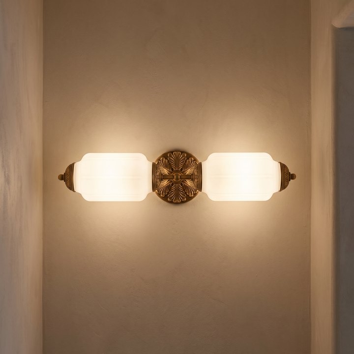Wren vanity bar lit on a plaster wall in a hallway