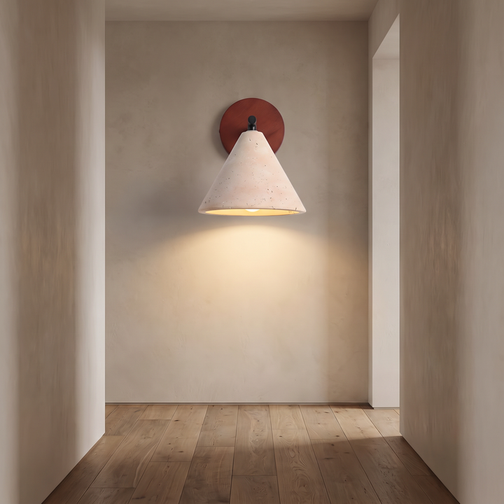 Thea wall sconce lighting a hallway wall