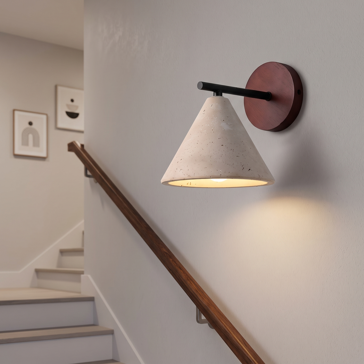 Thea wall sconce mounted in a stairwell