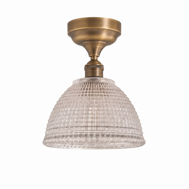 Romy prismatic glass semi flush mount ceiling light with antique brass canopy on a white background