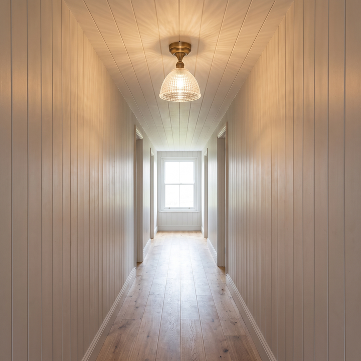 Romy ceiling light lit in a hallway