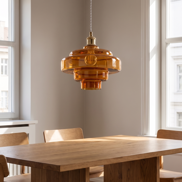Nora pendant above an oak dining table in daylight