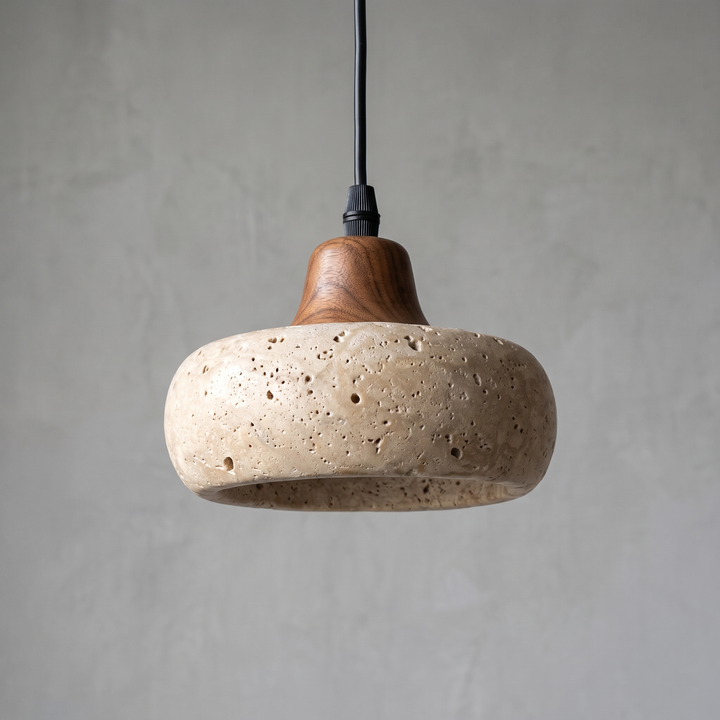 Close view of the travertine shade and walnut fitting of the Freya pendant