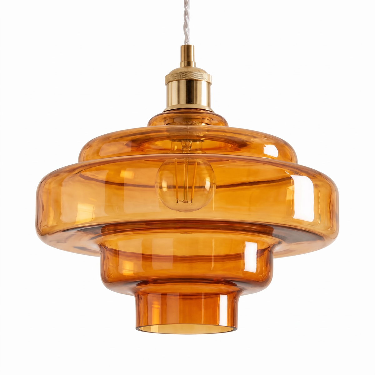 Nora tiered amber glass pendant light on a white background