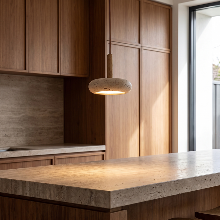 Maeve disc pendant hung low over a kitchen island