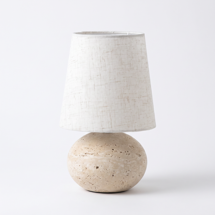Nella travertine and linen table lamp on a white background