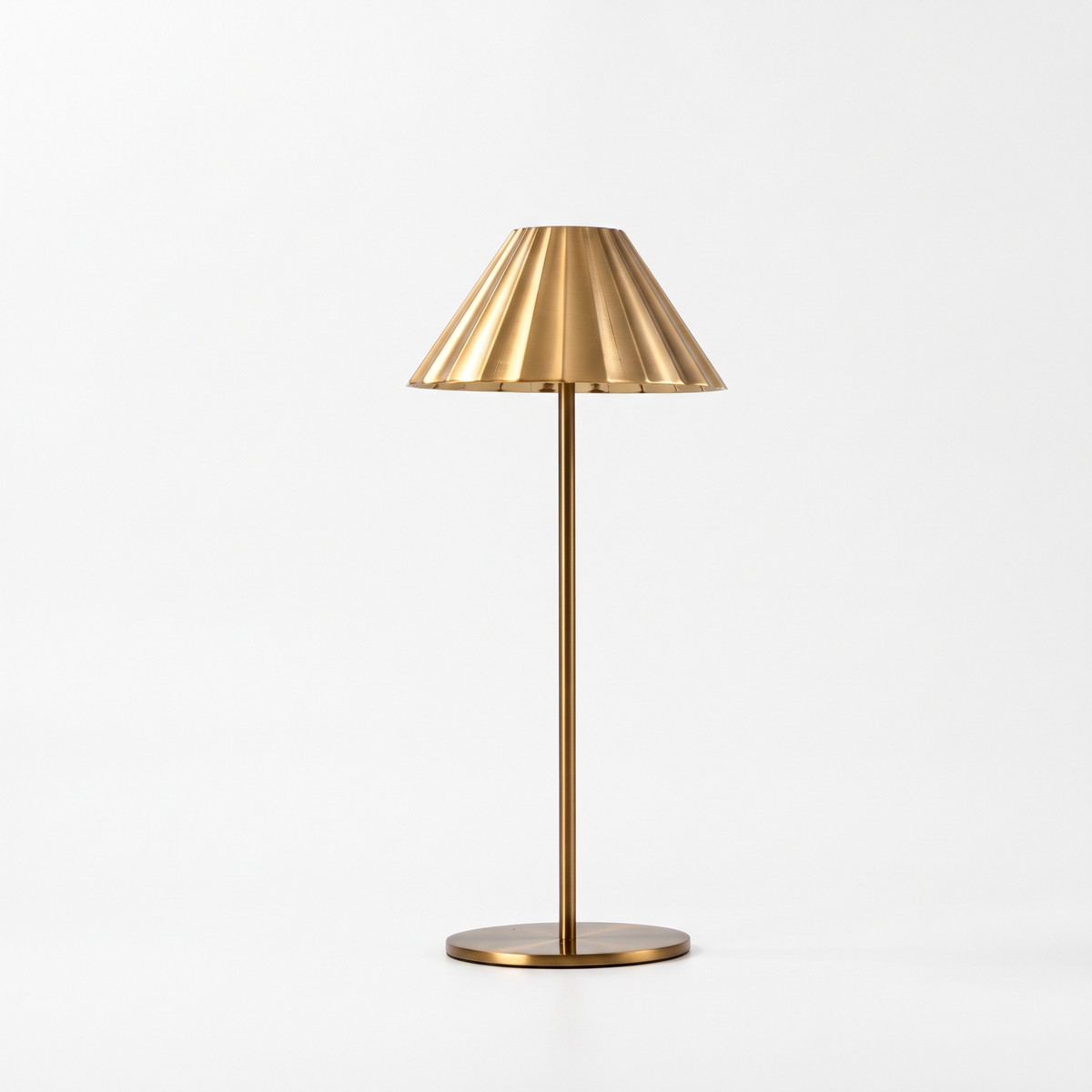 Isla brass fluted cordless table lamp on a white background