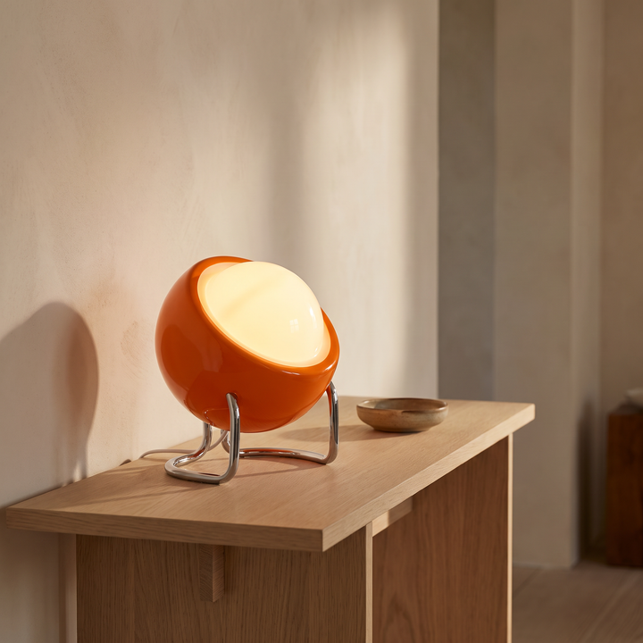 Ines open globe table lamp lit on a hallway console