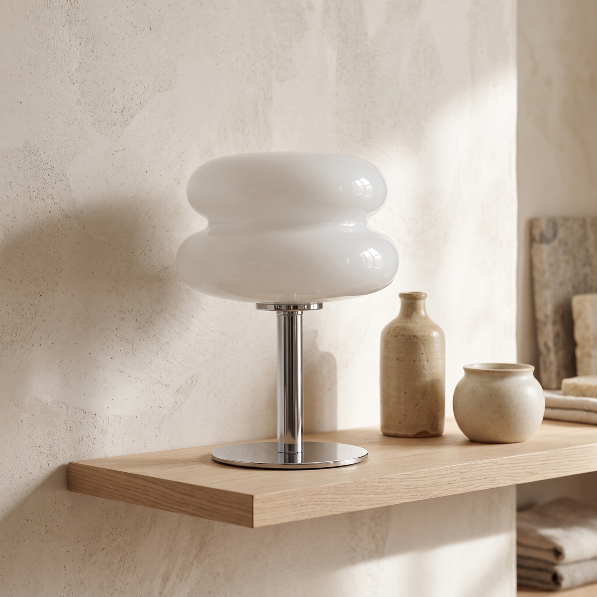 Sylvi glass dome table lamp on an oak shelf beside ceramics