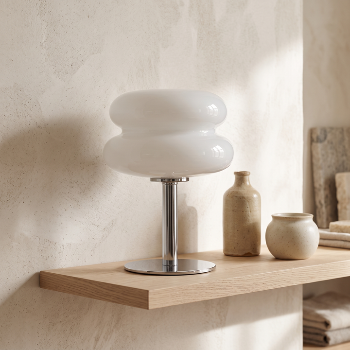 Sylvi glass dome table lamp on an oak shelf beside ceramics