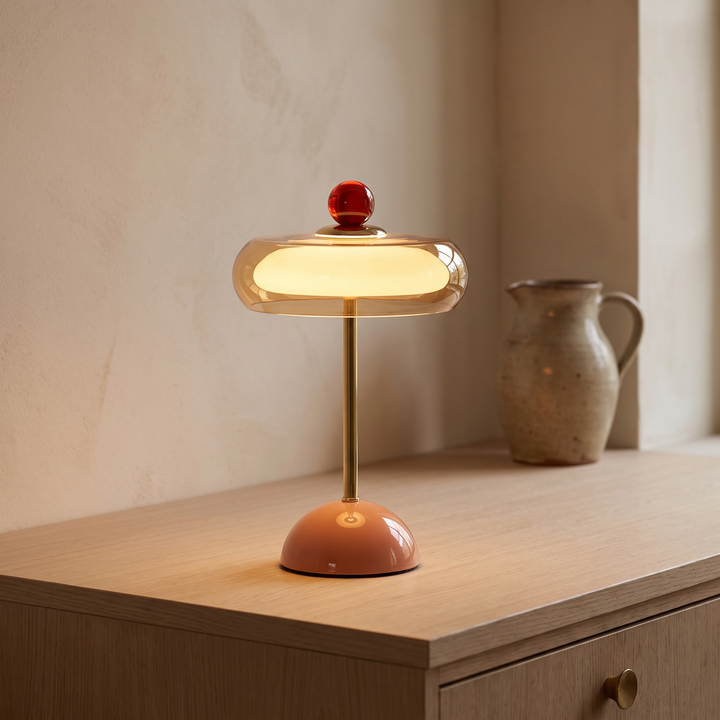 Runa cordless glass disc table lamp lit on an oak kitchen counter