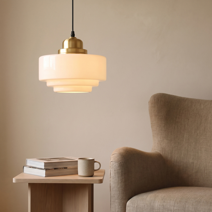 Vika milk glass pendant light, stepped profile, in a reading corner