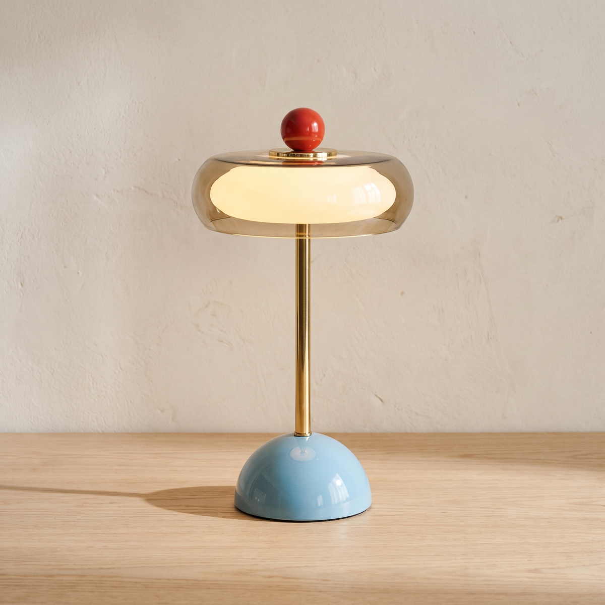 Runa cordless glass disc table lamp with a lake blue base