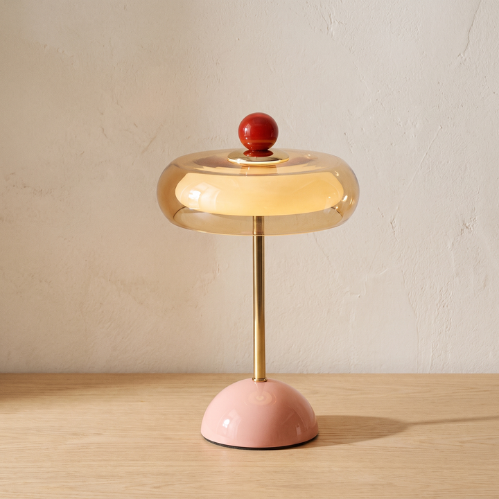 Runa cordless glass disc table lamp with a pink base