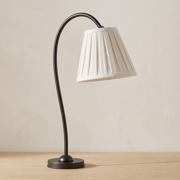 Marit pleated linen shade table lamp with a black arm