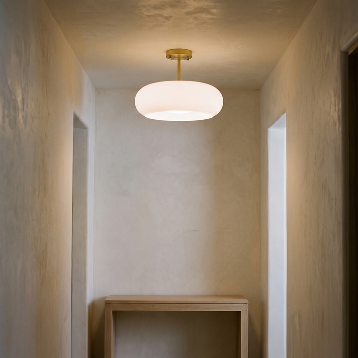 Greta white glass semi flush ceiling light with brass fitting, 11 inch, in a hallway