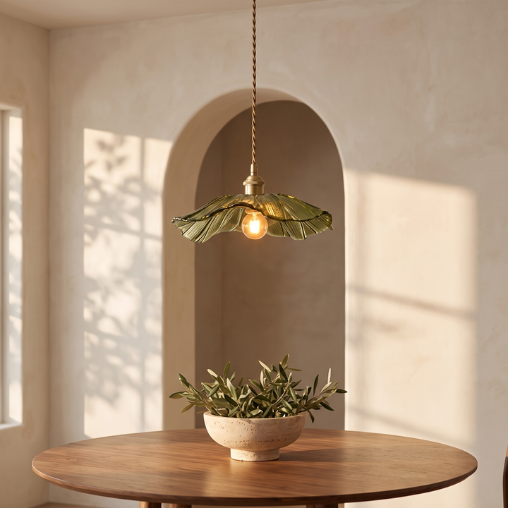 Ninfea pendant above a round walnut table in an arched alcove
