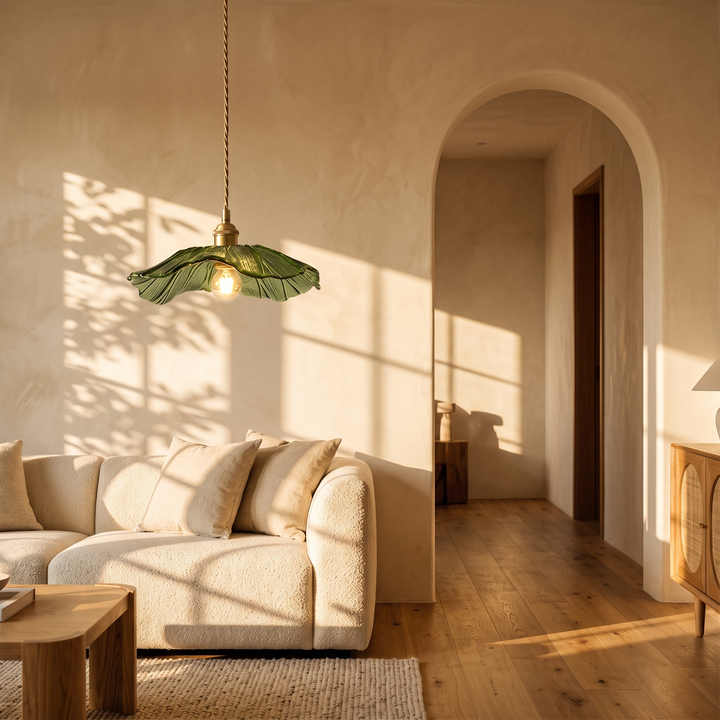 Ninfea pendant in a living room above a boucle sofa
