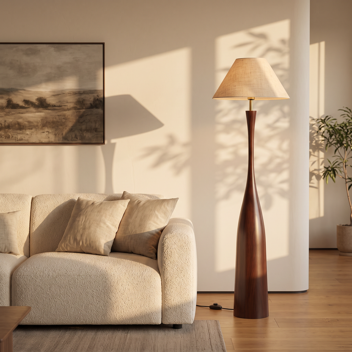 Morella floor lamp beside a cream boucle sofa