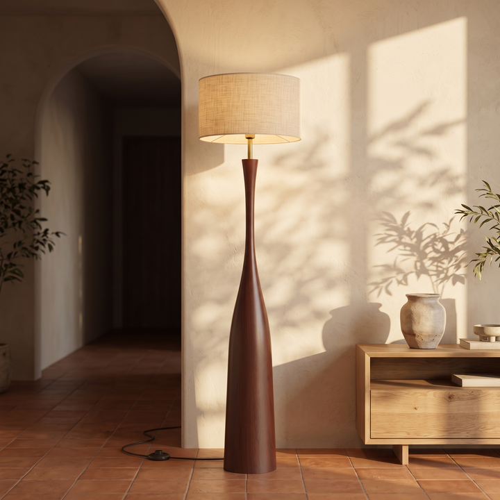 Morella floor lamp on terracotta tile beside an arched doorway