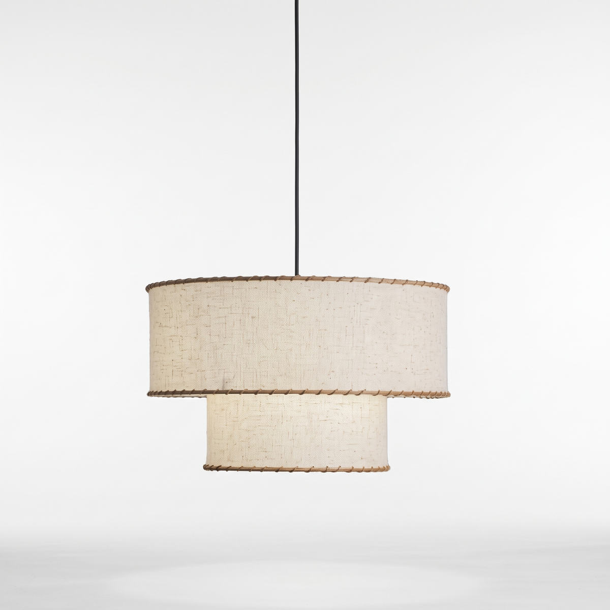 Rivelle two-tier linen pendant light on a white studio background
