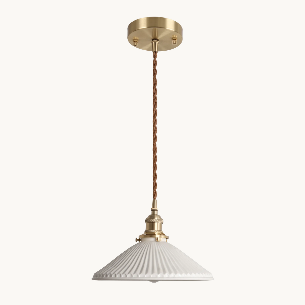 Bellora Cone fluted ceramic and brass pendant light on a pure white background