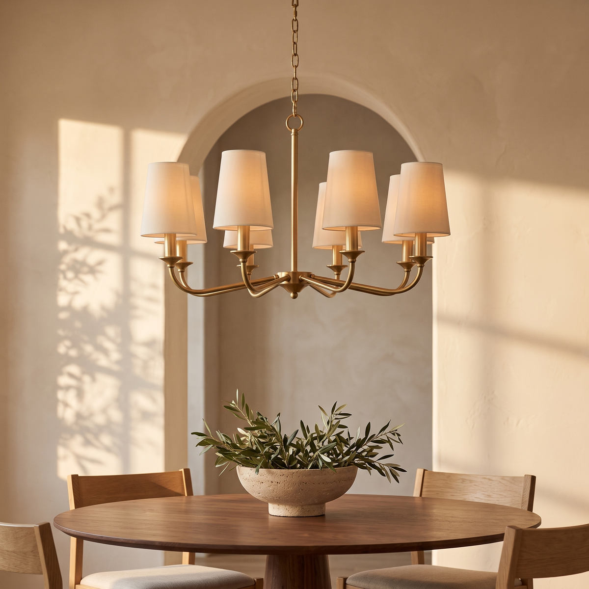 Caldera chandelier above a round walnut dining table
