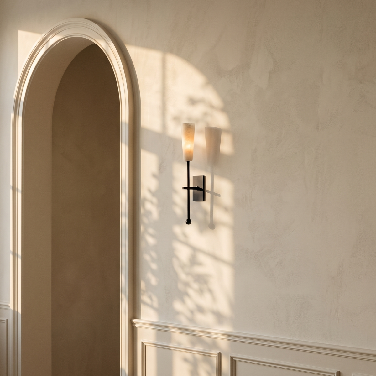 Tessara Torch wall sconce in black on a wainscoted wall
