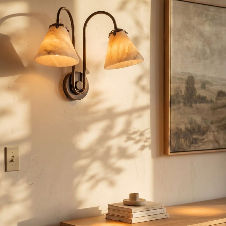 Fonteva twin marble cone sconce in copper above a sideboard