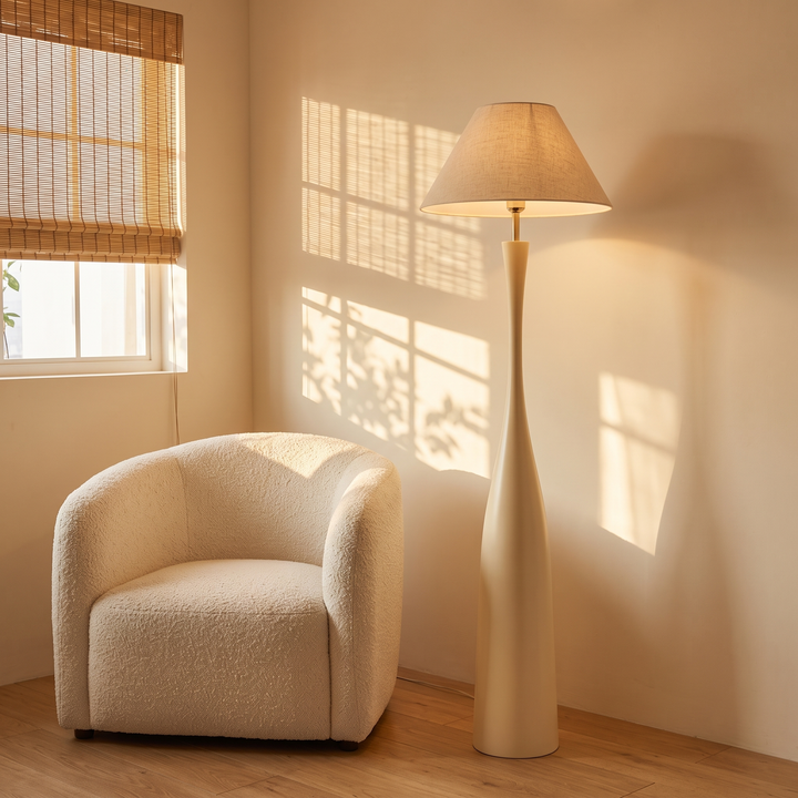 Morella beige floor lamp with 17.3 inch shade in a living room corner