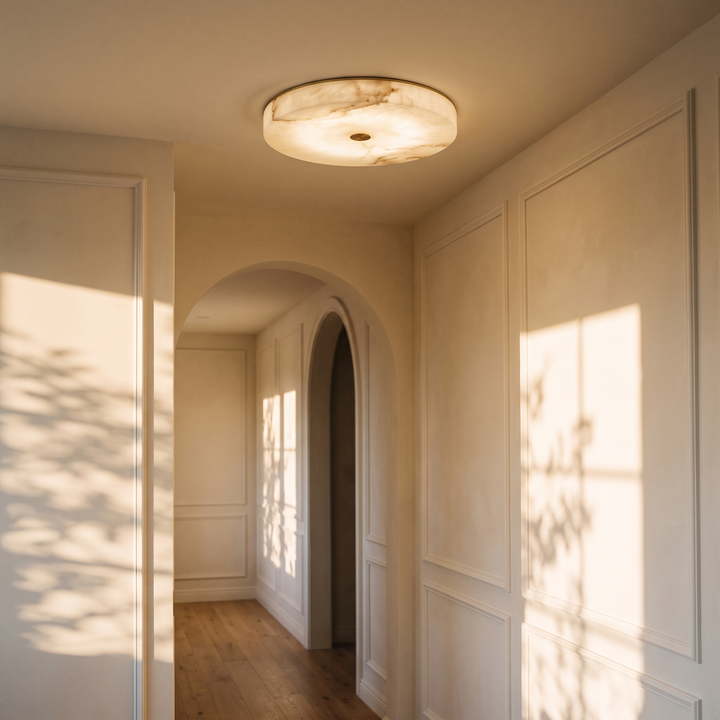 Lunetta natural marble flush ceiling light in a panelled hallway