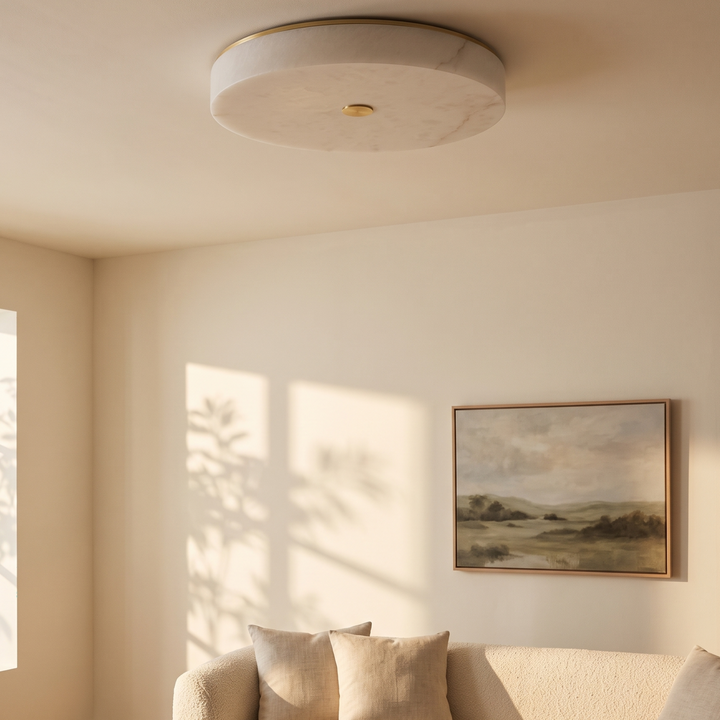 Lunetta scagliola flush ceiling light in a living room above a boucle sofa