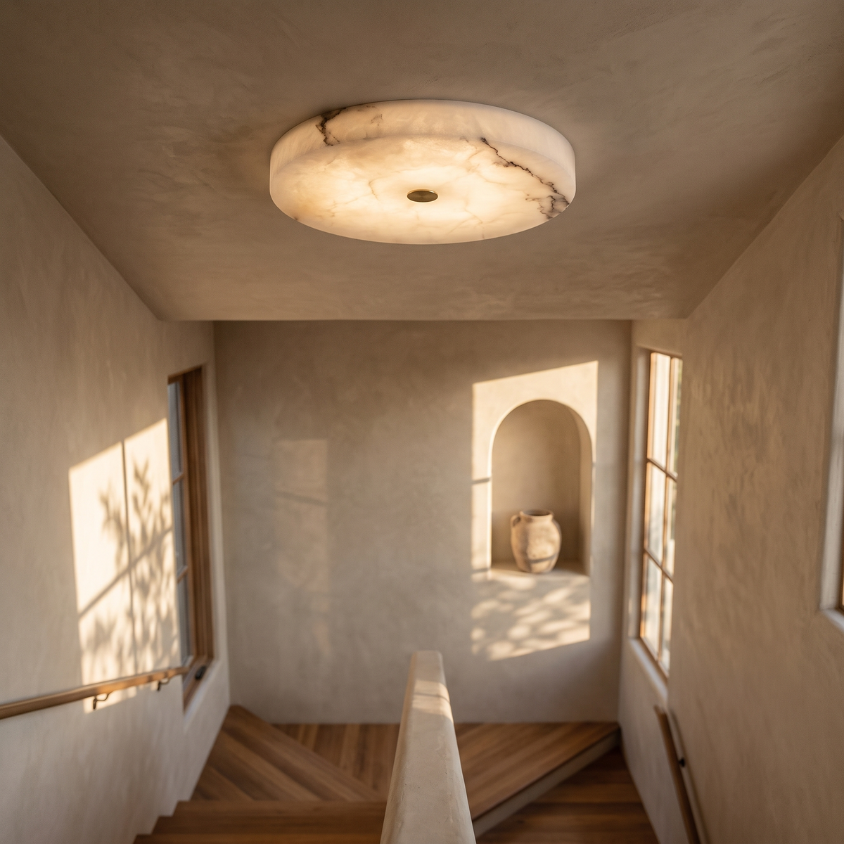 Lunetta natural marble flush ceiling light above a stair landing