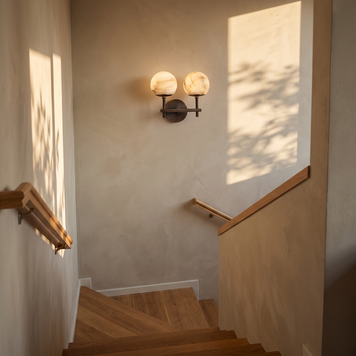Orbella Twin with 5.1 in marble spheres on a stair landing