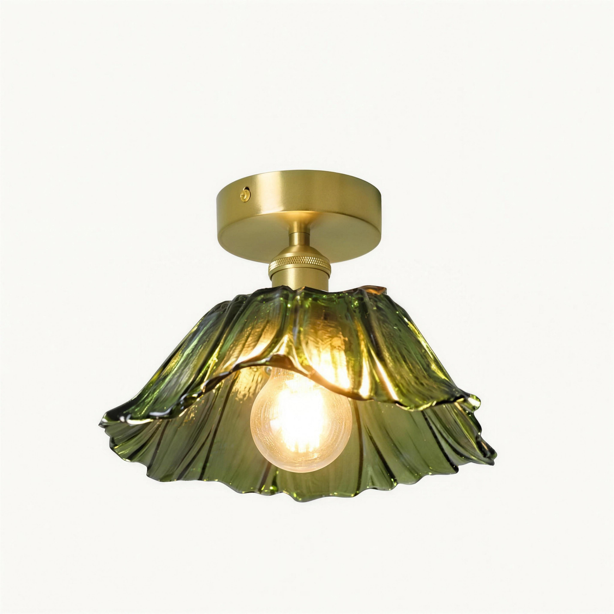 Fiorella flush mount petal glass ceiling light in leaf green on a white background