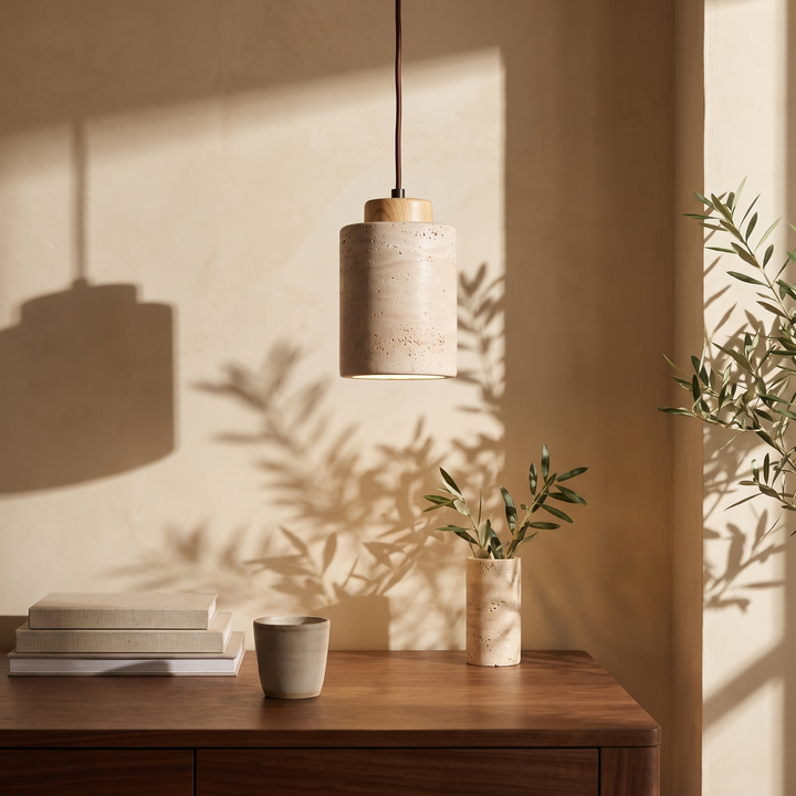 Edda Cylinder light wood travertine pendant light above a walnut desk