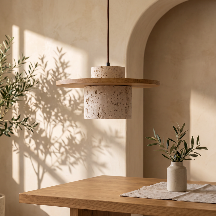 Edda Brim light wood travertine pendant light above an oak dining table