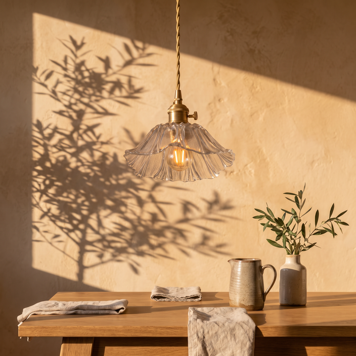 Fiorella petal glass cord pendant light in opal white above an oak dining table