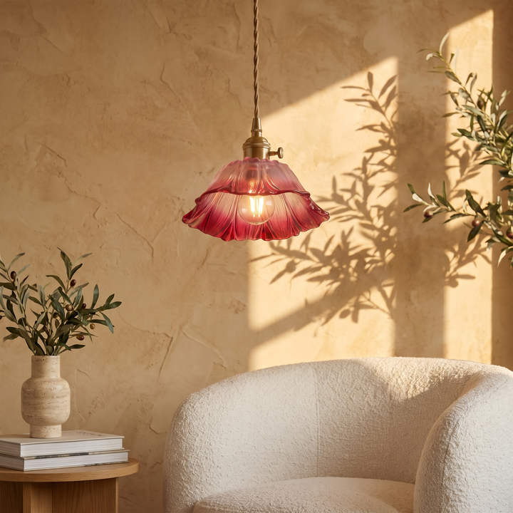 Fiorella petal glass cord pendant light in dusty mauve in a reading corner