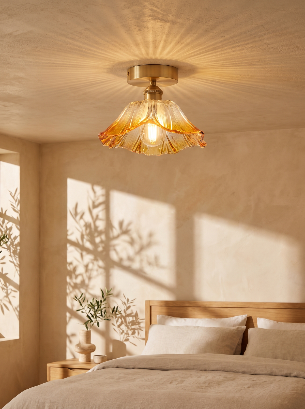 Fiorella flush mount in honey amber throwing a patterned wash on a bedroom ceiling